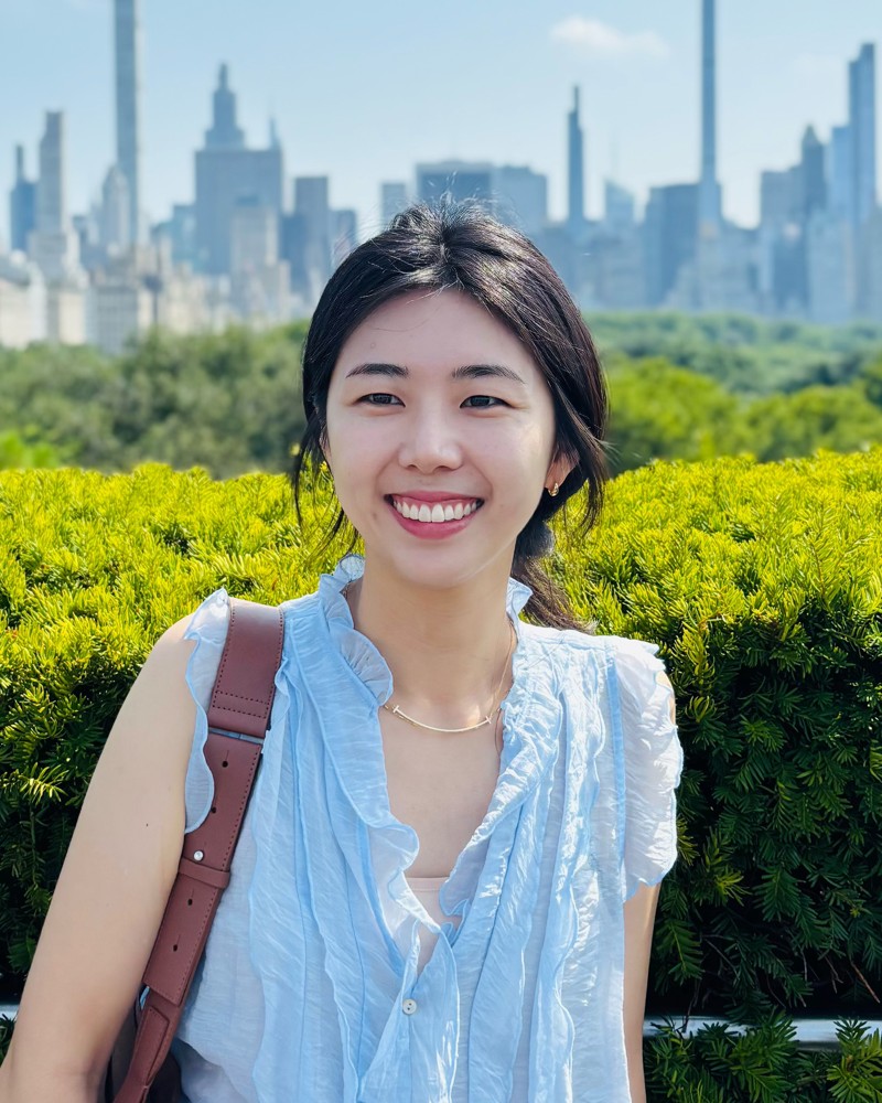 Christine P. Lee, smiling outdoors